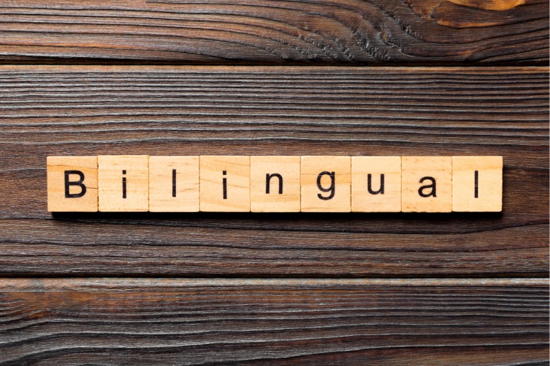 Wooden tiles spelling Bilingual / Fichas de madera que forman la palabra Bilingual